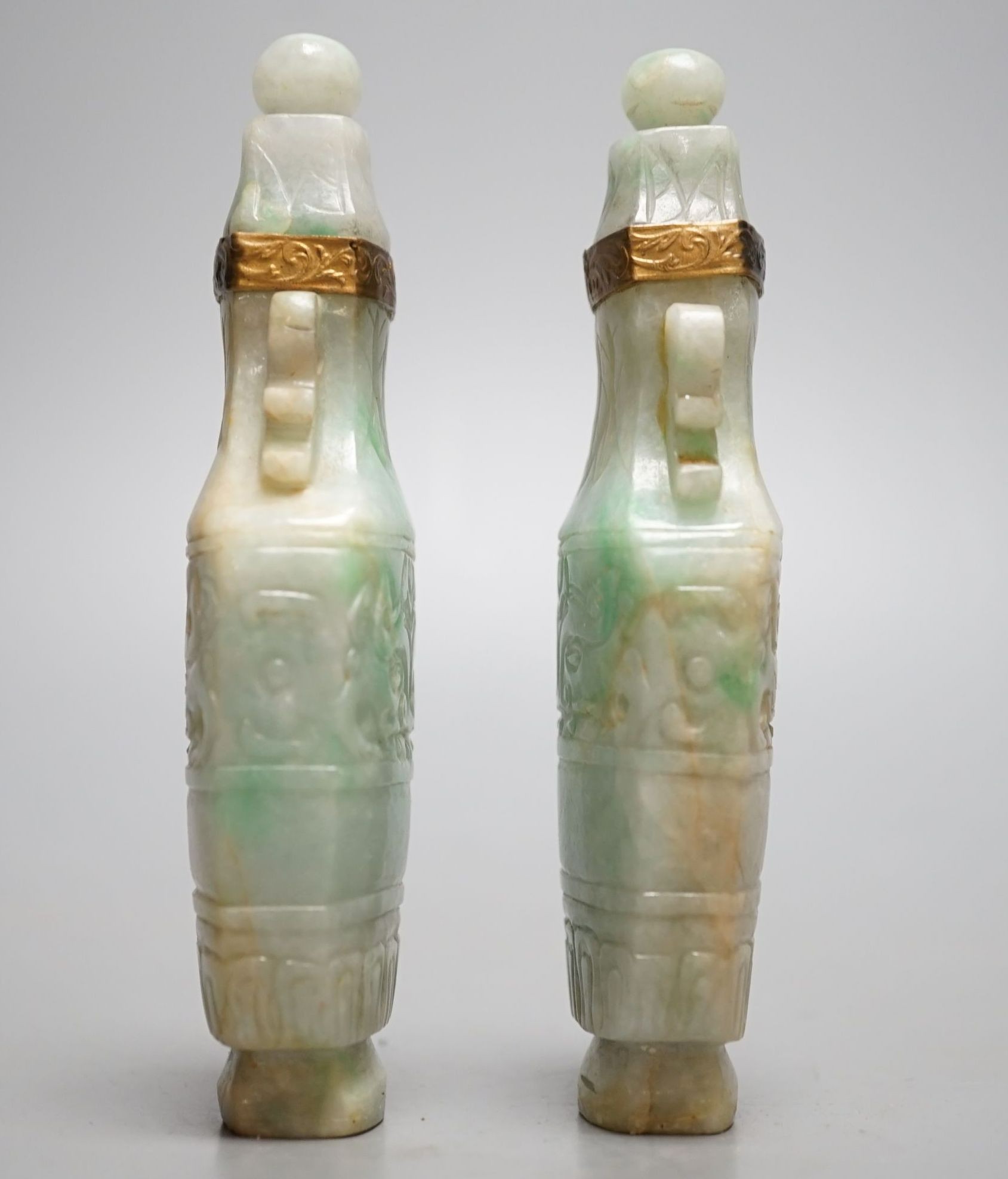 A pair of Chinese jadeite carved vases and covers